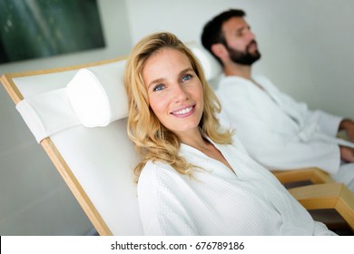 Beautiful woman with handsome man relaxing in spa