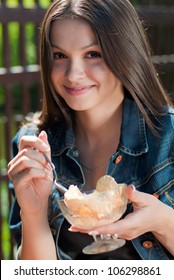 Beautiful Woman Happy Smiling Sitting In Cafe And Eating Ice Cream From Glass Bowl