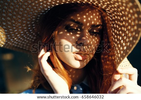 Similar – Young redhead woman covering from sun