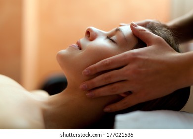 Beautiful woman having a facial massage  - Shutterstock ID 177021536