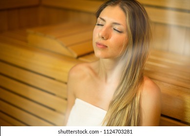 Beautiful Woman Having A Sauna Bath In A Steam Room