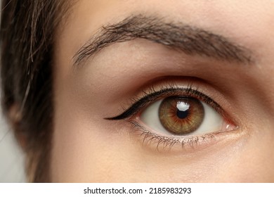 Beautiful woman with hazel eye, closeup view