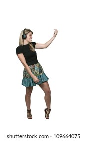 Beautiful Woman With Headphones Playing The Air Guitar