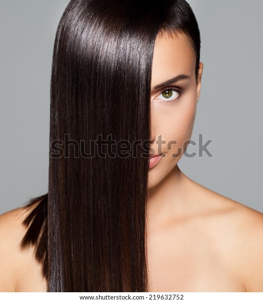 Beautiful woman
with healthy silky hair
posing.