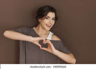 Beautiful Woman With Heart Sign 