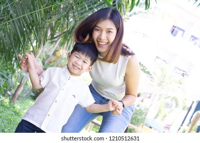 Beautiful woman and her cute little son, loving family and mother. - Shutterstock ID 1210512631