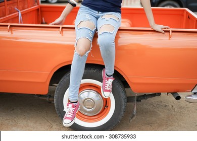 A Beautiful Woman With Her Old Pickup Truck