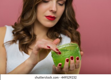 Beautiful Woman Holding An Aloe Vera Gel Bottle