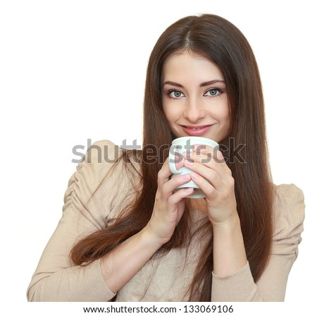 Beautiful woman holding cup with drink and looking happy isolated on white background
