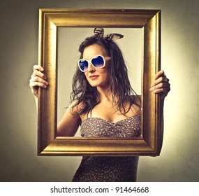 Beautiful Woman Holding An Empty Frame