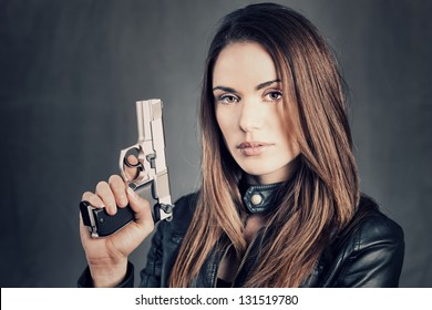 Beautiful Woman Holding Up Her Gun