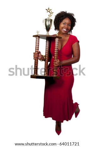 A beautiful woman holding a large trophy