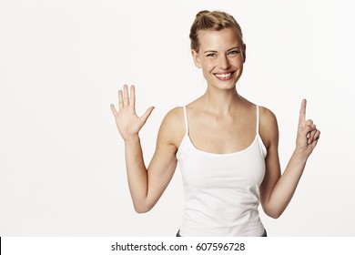 Beautiful Woman Holding Up Six Fingers, Portrait