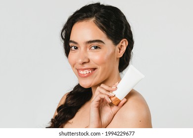 Beautiful Woman Holding A Skin Care Product