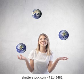 Beautiful Woman Juggling With Earths