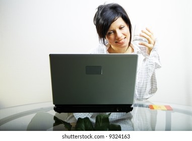 beautiful woman with laptop in mens shirt