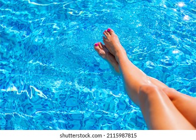 Beautiful Woman Legs In Swimming Pool Water