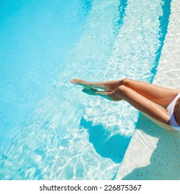Beautiful Woman Legs In Swimming Pool.