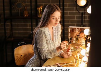 Beautiful Woman With Lipgloss In Dressing Room At Night