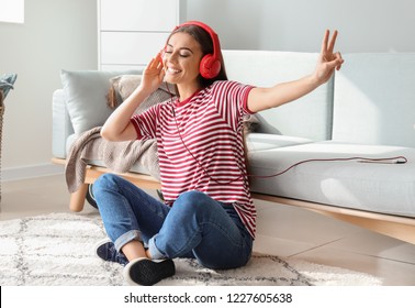 Beautiful Woman Listening To Music At Home