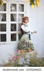 A Beautiful Woman In Lolita Dress In Garden Background Japanese Street Fashion Portrait