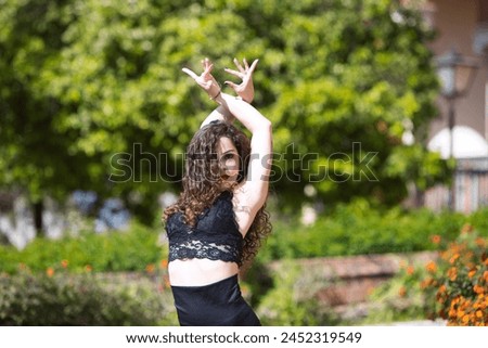 Similar – Image, Stock Photo Smiling brunette girl holding surfboard over her head