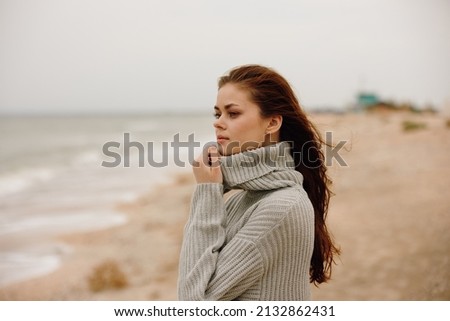 beautiful woman with long hair on the beach nature landscape walk Happy female relaxing