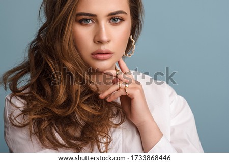 Similar – Image, Stock Photo Long-haired curly woman plus size in a wreath of red poppies stands among a field of meadow flowers and covers her face with a bouquet of poppies
