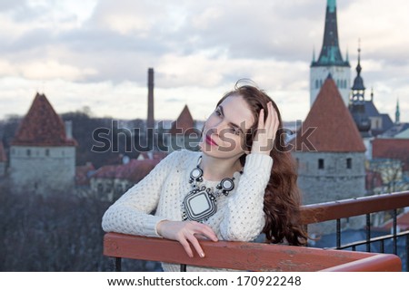 beautiful woman looking down at the city of Tallinn