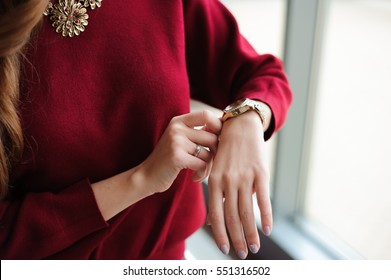 Beautiful Woman Looks At The Clock Waiting For The Plane At The Airport