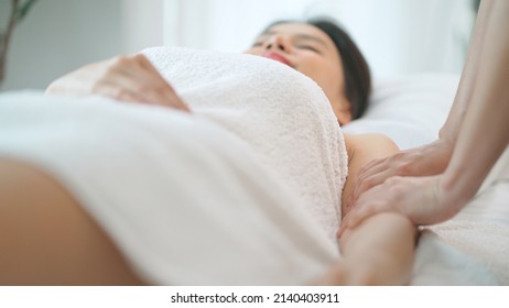 Beautiful Woman Lying On The Spa Bed And Receiving Massage Of Upper Body. Relaxation And Revitalization Of Muscles After Work. Therapist Massage At Arm. Healthy Lifestyle And Body Concept