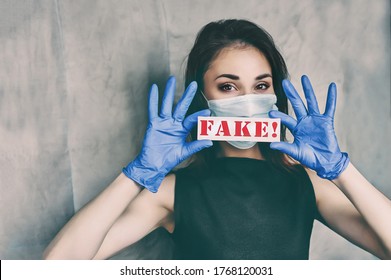 Beautiful Woman In A Medical Mask And Gloves Holds A Red Inscription 