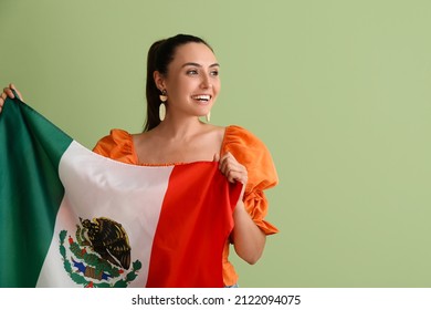 Beautiful Woman With Mexican Flag On Green Background