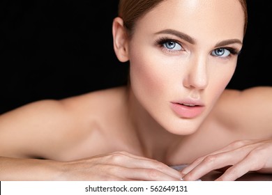 Beautiful Woman Model With No Makeup And Clean Healthy Skin Face On Black Background