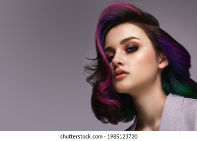 Beautiful woman and multi  colored hair   classic make up   hairstyle  Beauty face 