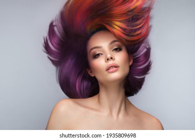 Beautiful woman with multi-colored hair and creative make up and hairstyle. Beauty face. - Shutterstock ID 1935809698