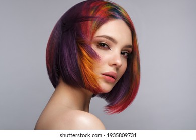 Beautiful woman and multi  colored hair   creative make up   hairstyle  Beauty face 