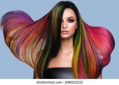 Beautiful woman with multi-colored hair and creative make up and hairstyle. Beauty face. - Shutterstock ID 2080522231