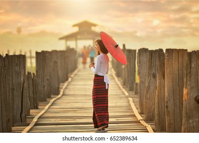 The Beautiful Woman Myanmar In U-ben Bridge On During Sunrise , Treaditional Culture ,Mandalay Myanmar