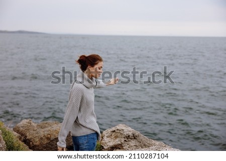 Similar – Senior sportswoman looking at the sea