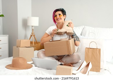 Beautiful Woman With New Shoes In Bedroom. Online Shopping