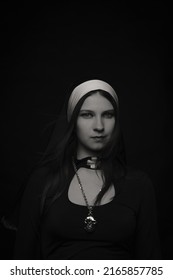 Beautiful Woman In Nun Costume Over Dark Background