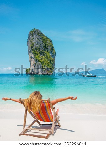 Beautiful woman on the beach in Thailand Winter holidays in the sun