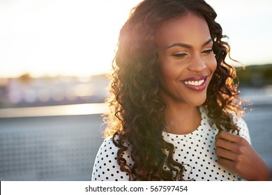 Beautiful Afro american Woman On A Blurry Background Smiling