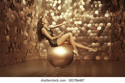 Beautiful Woman On A Gold Ball