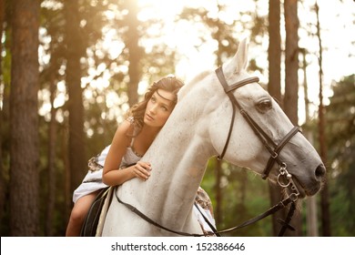 Beautiful woman on a horse. Horseback rider, woman riding horse
