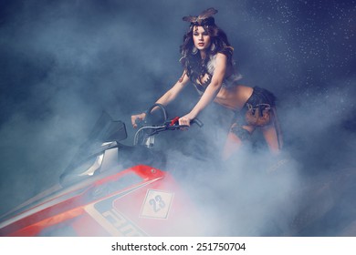 Beautiful Woman On Snowmobile