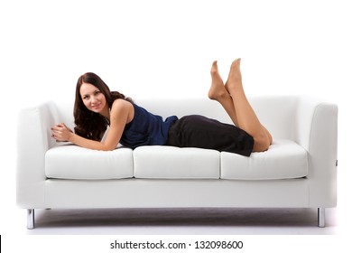 beautiful woman on a sofa, on a white background