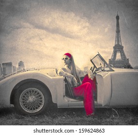 Beautiful Woman On A Vintage Car In Paris