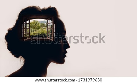 Beautiful woman with opened window with garden in her head.